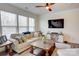 Bright living room featuring a comfortable sofa and large TV at 3936 Rothwood Ln, Harrisburg, NC 28075