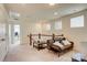 Spacious loft area with comfortable seating and natural light at 3936 Rothwood Ln, Harrisburg, NC 28075