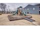 Community playground with green slides and ramp at 3936 Rothwood Ln, Harrisburg, NC 28075