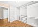 Spacious walk-in closet with built-in shelving and a view of the bathroom at 404 Ford St, Kannapolis, NC 28083