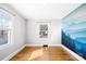 Bedroom with hardwood floors, mountain mural, and large window at 404 Ford St, Kannapolis, NC 28083