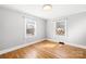 Bright bedroom featuring hardwood floors and a view of the street at 404 Ford St, Kannapolis, NC 28083