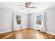 Spacious bedroom with hardwood floors and two large windows at 404 Ford St, Kannapolis, NC 28083