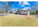 Ranch style home with brick facade and spacious yard at 404 Ford St, Kannapolis, NC 28083