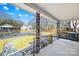 Covered front porch with wrought iron railings and swing at 404 Ford St, Kannapolis, NC 28083