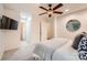 Comfortable bedroom with soft carpet, ceiling fan, and adjacent bathroom access for added convenience at 4145 Wall St, Charlotte, NC 28209