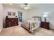 Cozy bedroom with natural light, carpeted floors, a bed, and dresser at 4145 Wall St, Charlotte, NC 28209
