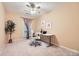 Comfortable bedroom with neutral tones, desk, office chair, and ample lighting at 4145 Wall St, Charlotte, NC 28209