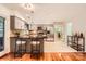Open kitchen featuring an island with bar seating, stainless steel appliances, and ample counter space at 4145 Wall St, Charlotte, NC 28209