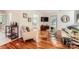 Bright living room with gleaming hardwood floors, modern furniture, and ample natural light, perfect for relaxation at 4145 Wall St, Charlotte, NC 28209