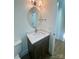 Elegant half-bath features a vanity with stone countertops, decorative mirror, and modern fixtures at 425 Delburg Mill Alley Dr, Davidson, NC 28036