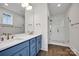 A full bathroom is complete with double sinks, wood-look tile and a glass-enclosed shower at 425 Delburg Mill Alley Dr, Davidson, NC 28036