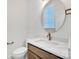 Modern bathroom features a round mirror and sleek fixtures at 425 Delburg Mill Alley Dr, Davidson, NC 28036