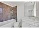 Modern bathroom featuring dual shower heads, a sleek vanity with ample counter space, and stylish tile accents at 425 Delburg Mill Alley Dr, Davidson, NC 28036