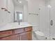 Modern bathroom with a glass shower, quartz countertop vanity, and stylish hardware, creating a spa-like retreat at 425 Delburg Mill Alley Dr, Davidson, NC 28036