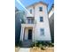 Charming two-story home with a covered porch and fresh landscaping at 425 Delburg Mill Alley Dr, Davidson, NC 28036