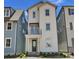 Charming two-story home with a front porch and balcony on a sunny day at 425 Delburg Mill Alley Dr, Davidson, NC 28036