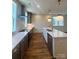 Spacious kitchen boasts an island, stainless steel appliances, and ample counter space at 425 Delburg Mill Alley Dr, Davidson, NC 28036