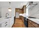 Spacious kitchen with a central island, modern stainless steel appliances, and wooden cabinets at 425 Delburg Mill Alley Dr, Davidson, NC 28036
