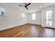 Bright living room with sleek wood floors and glass patio door at 425 Delburg Mill Alley Dr, Davidson, NC 28036