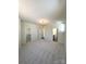 Spacious main bedroom featuring plush carpeting, a walk-in closet, and ensuite bathroom access at 425 Delburg Mill Alley Dr, Davidson, NC 28036