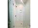 Bright, white-tiled shower with glass enclosure, niche and bronze hardware at 425 Delburg Mill Alley Dr, Davidson, NC 28036