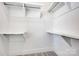 A spacious walk-in closet offers plenty of storage with built in shelving at 425 Delburg Mill Alley Dr, Davidson, NC 28036