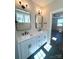 Bathroom featuring a double sink vanity, modern fixtures, and neutral paint at 429 Delburg Mill Alley Dr, Davidson, NC 28036