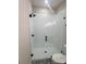 Contemporary bathroom featuring a glass-enclosed shower with white tiling and matte black hardware at 429 Delburg Mill Alley Dr, Davidson, NC 28036