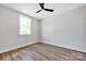 Bedroom with ceiling fan, light gray paint, and wood flooring at 429 Delburg Mill Alley Dr, Davidson, NC 28036