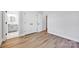 Bedroom featuring hardwood floors, a closet, and ensuite bath creating a private retreat at 429 Delburg Mill Alley Dr, Davidson, NC 28036