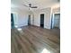 Large bedroom featuring hardwood floors, a ceiling fan, and closet at 429 Delburg Mill Alley Dr, Davidson, NC 28036