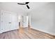 Bedroom featuring wood floors, double closet, and access to an en-suite bathroom at 429 Delburg Mill Alley Dr, Davidson, NC 28036