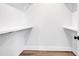 Bright, walk-in closet with wooden floors and built-in shelving for optimal storage and organization at 429 Delburg Mill Alley Dr, Davidson, NC 28036