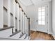 Entryway features hardwood floors, white trim, and a glass-paneled front door at 429 Delburg Mill Alley Dr, Davidson, NC 28036