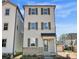Charming new construction with Hardie Board siding and brick base, accented by shutters and a covered entry at 429 Delburg Mill Alley Dr, Davidson, NC 28036