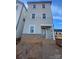 Three story home featuring beautiful blue siding and a brick foundation, steps to the covered front door at 429 Delburg Mill Alley Dr, Davidson, NC 28036