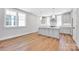 This bright and airy kitchen features stainless appliances, light gray cabinetry, and hardwood flooring at 429 Delburg Mill Alley Dr, Davidson, NC 28036