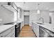 This kitchen features stainless steel appliances, light gray cabinets, and a modern design at 429 Delburg Mill Alley Dr, Davidson, NC 28036