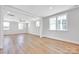 Open living room with hardwood floors and light gray walls at 429 Delburg Mill Alley Dr, Davidson, NC 28036