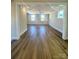 Spacious living room featuring abundant natural light and modern vinyl flooring at 429 Delburg Mill Alley Dr, Davidson, NC 28036