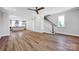 Spacious open concept living space leading into the kitchen with hardwood floors and lots of light at 429 Delburg Mill Alley Dr, Davidson, NC 28036