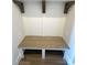 Convenient mudroom with a built-in bench and decorative wooden corbels for added charm at 429 Delburg Mill Alley Dr, Davidson, NC 28036