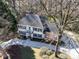 Aerial view of a two-story house with a large driveway at 4342 Arborway None, Charlotte, NC 28211