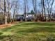 Private backyard with mature trees and a deck at 4342 Arborway None, Charlotte, NC 28211