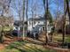 House with a large deck and stairs leading to the backyard at 4342 Arborway None, Charlotte, NC 28211