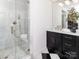 Elegant bathroom with marble shower, black vanity, and gold fixtures at 4342 Arborway None, Charlotte, NC 28211