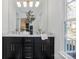 Modern bathroom with dual vanity, marble countertops, and gold accents at 4342 Arborway None, Charlotte, NC 28211