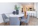 Dining area with marble table and gray chairs, open to kitchen at 4342 Arborway None, Charlotte, NC 28211