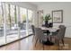 Dining area with marble table, gray chairs, and access to deck at 4342 Arborway None, Charlotte, NC 28211